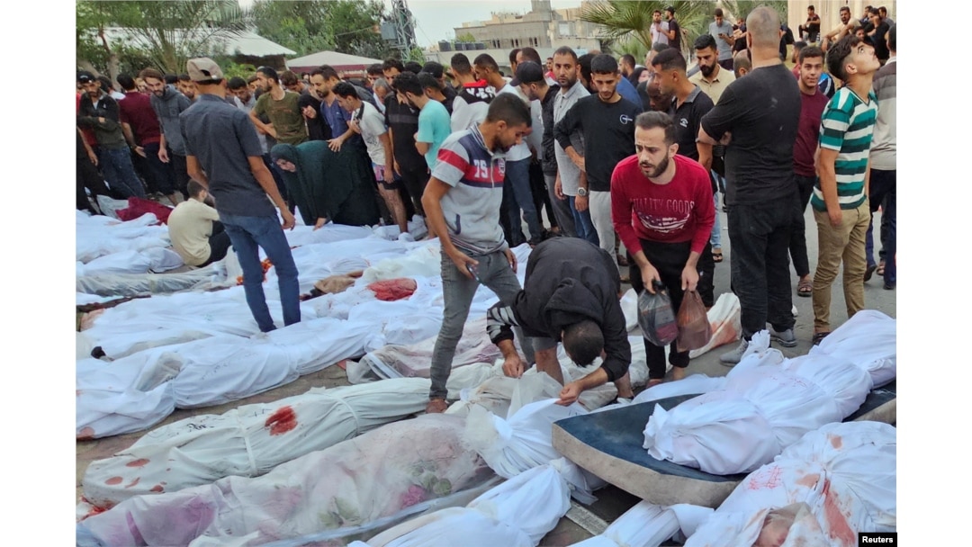 Bodies of Palestinians killed in Israeli strikes on houses in Jabalia refugee camp, lie at a hospital in the northern Gaza Strip, Oct. 31, 2023.
