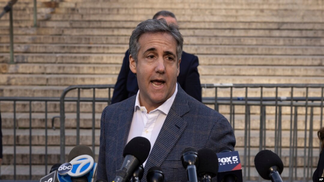 FILE - Michael Cohen speaks to members of media as he arrives for former President Donald Trump's civil business fraud trial at New York Supreme Court, Oct. 24, 2023.