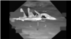 Borbeni avion J-11 kineske Narodnooslobodilačke armije na fotografiji napravljenoj od video snimka iz bombardera B-52 američke avijacije, 24. oktobra 2023. 