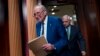 Senate Majority Leader Chuck Schumer, D-N.Y., with Senate Armed Services Committee Chairman Jack Reed, D-R.I., arrives to speak with reporters after completing work on the fiscal 2024 military spending bill, at the Capitol in Washington, July 27, 2023.