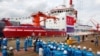 FILE - People attend the launch ceremony of China's first domestically built polar icebreaker, Xuelong 2, or Snow Dragon 2, at a shipyard in Shanghai, Sept. 10, 2018. 