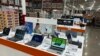 FILE - Laptop computers are displayed in a Costco warehouse, June 6, 2023, in Colorado Springs, Colorado.