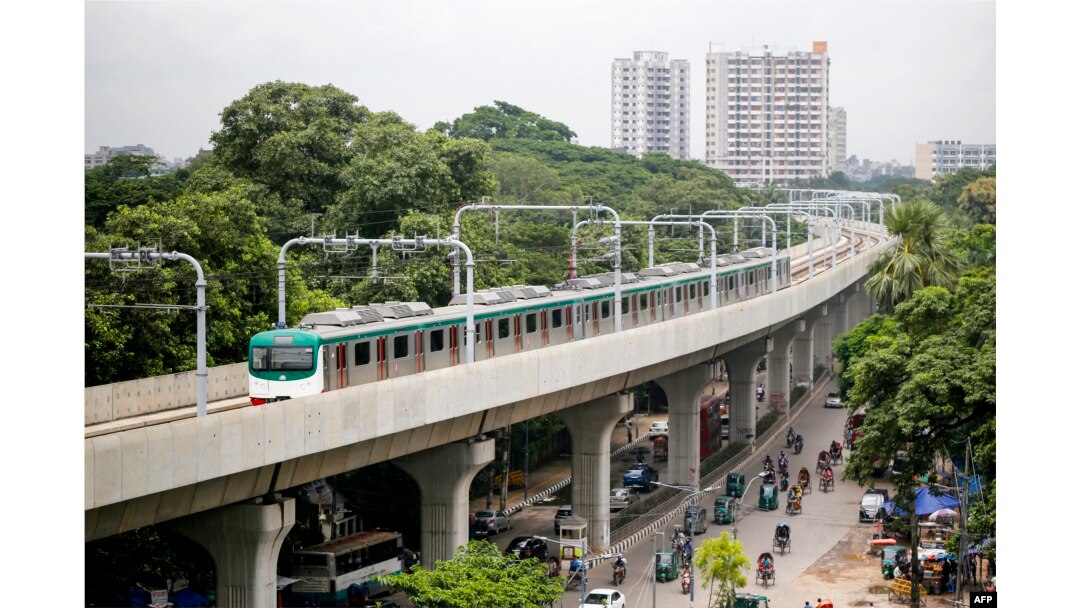 A metro train rides along a transit line in Dhaka, Aug. 25, 2024. Bangladesh's metro railine in the notoriously congested capital Dhaka resumed, more than a month after it was closed during peak of student-led protests.