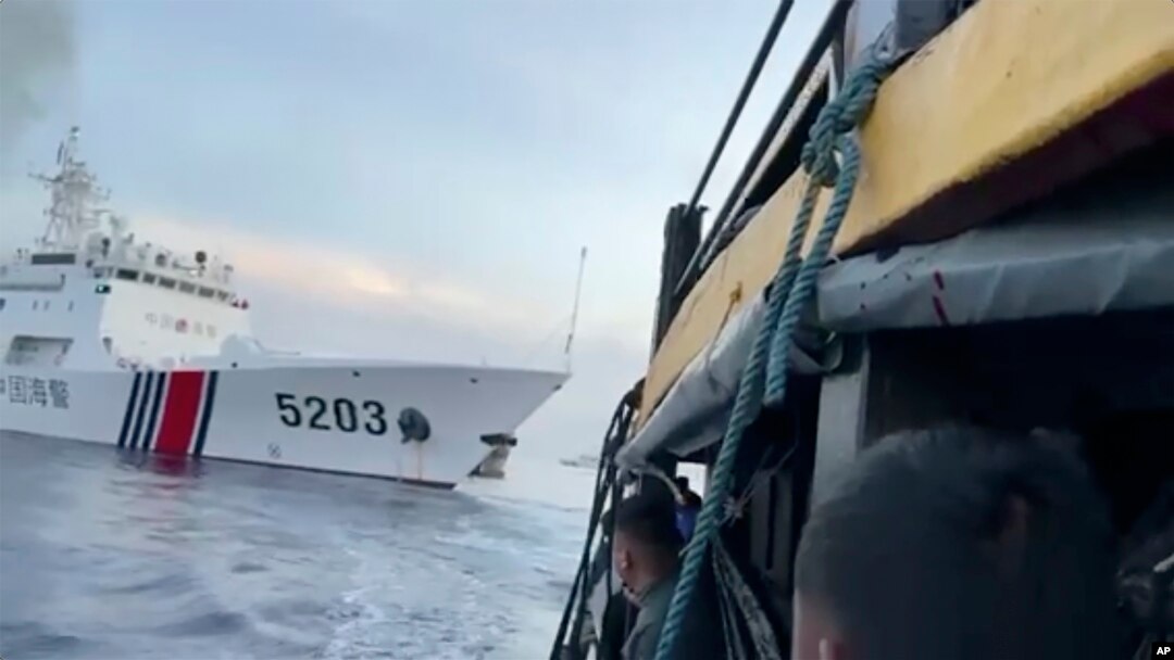 This image shows Filipino sailors look after a Chinese coast guard ship with bow number 5203 bumps their supply boat as they approach Second Thomas Shoal, in the South China Sea on Sunday Oct. 22, 2023. (Armed Forces of the Philippines via AP)