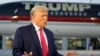 FILE - Former President Donald Trump speaks with reporters before departure from Hartsfield-Jackson Atlanta International Airport, in Atlanta, Aug. 24, 2023.
