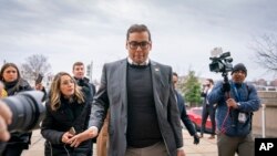 FILE - Rep. George Santos, R-N.Y., leaves a House GOP conference meeting on Capitol Hill in Washington, Jan. 25, 2023.