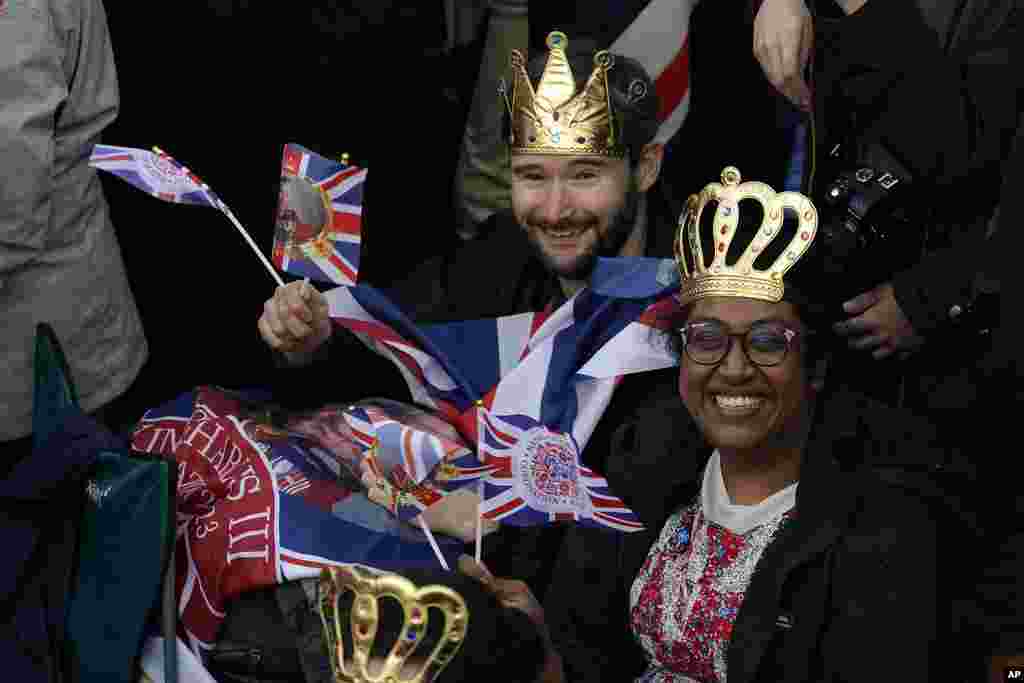 Royal fans take their seats where they can watch the procession of the coronation of Britain's King Charles III in London, May 6, 2023.