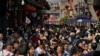 2023年5月1日，中国五一劳动节期间，北京前门步行购物街上挤满了游客。