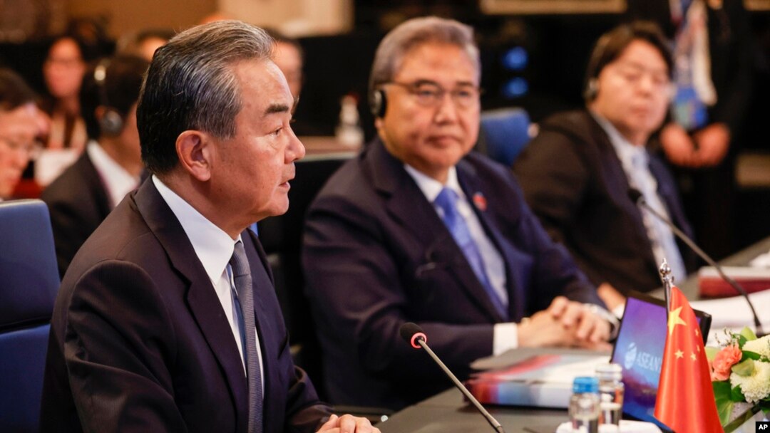 FILE - Chinese foreign policy chief Wang Yi, left, speaks as South Korean Foreign Minister Park Jin, center, and Japanese Foreign Minister Yoshimasa Hayashi listen during an ASEAN Plus Three foreign ministers meeting in Jakarta, Indonesia, July 13, 2023. 