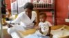 A nurse cares for an infant at the Centre Hospitalier de Fontaine, located in the impoverished neighborhood of Cite Soleil, where the two rival gangs, G-Pep and G9, are based, in Port-au-Prince, Haiti, July 26, 2023. 
