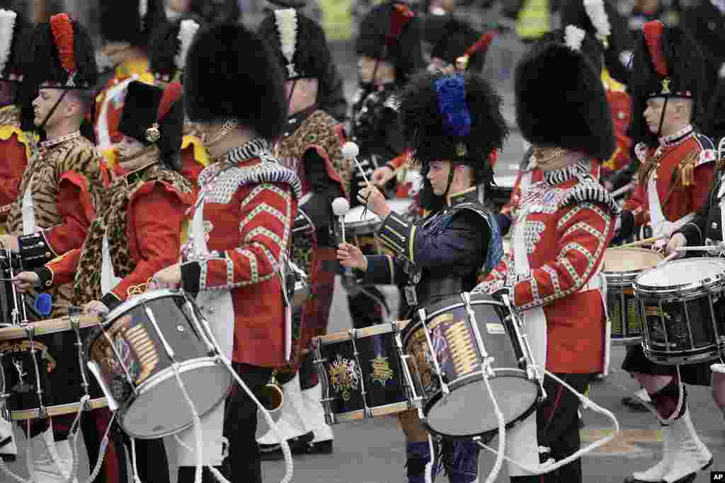 Troops march outside the Palace of Westminster ahead of Britain's King Charles III coronation ceremony in London, May 6, 2023. 