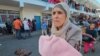 Palestinka ispred u dvorištu škole Ujedinjenih nacija gde su smešteni ljudi koji su napustili domove u severnom delu Pojasa Gaze (Foto: REUTERS/Anas al-Shareef)