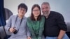 Emily Chen, flanked by her son and husband, Mark Lent, takes the Victoria Peak tram in Hong Kong in 2018. Chen was detained by Chinese authorities on Dec. 29, 2023, and has been held since then on charges of spying. (Photo courtesy of Mark Lent)