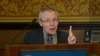 In this image taken from a video, Sean Turnell, an economist at Australia’s Macquarie University, speaks in front of audience at the Lowy Institute in Sydney, Australia on Nov. 28, 2013.