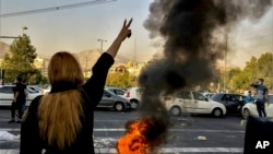 FILE - In this photo taken by an individual not employed by the Associated Press and obtained by the AP outside Iran, Iranians protest the death of 22-year-old Mahsa Amini after she was detained by the morality police, in Tehran, Oct. 1, 2022.