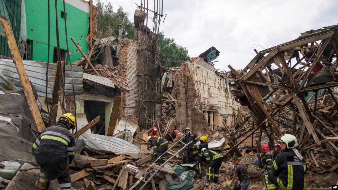 Rescuers remove debris following a Russian missile attack in Chuhuiv, Kharkiv region, Ukraine, July 25, 2022.