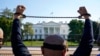 FILE - A member of the Uyghur American Association rallies in front of the White House, Oct. 1, 2020, after marching from Capitol Hill in Washington, in support of the Uyghur Forced Labor Prevention Act. The legislation was signed into law in late 2021.