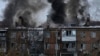 Ukrainian State Emergency Service firefighters work to extinguish a fire at the scene of a Russian shelling in the town of Vyshgorod outside of the capital Kyiv, Ukraine, Nov. 23, 2022. 
