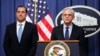 Attorney General Merrick Garland speaks during a news conference at the Department of Justice, Jan. 12, 2023, in Washington, as John Lausch, the U.S. attorney in Chicago, looks on.
