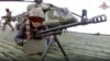 Russian soldiers take their position upon landing at an unspecified location in Ukraine, in this handout photo taken from video released by Russian Defense Ministry Press Service on Dec. 6, 2022.