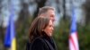 U.S. Vice President Kamala Harris, foreground, and Romanian President Klaus Iohannis attend a welcome ceremony in Bucharest, Romania, March 11, 2022. 