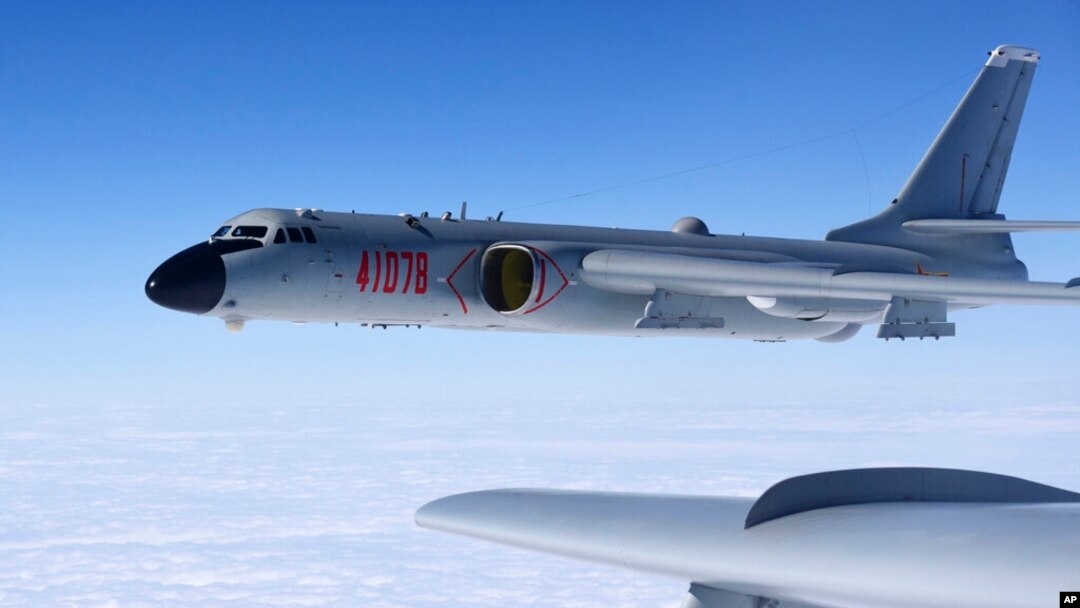 FILE - In this Nov. 23, 2017, photo released by Xinhua News Agency, a Chinese military H-6K bomber is seen conducting training exercises, as the People's Liberation Army Air Force conducted a combat air patrol in the South China Sea.