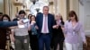 FILE - House Republican Leader Kevin McCarthy rushes to his office with reporters in pursuit at the Capitol in Washington, May 12, 2022. 