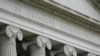 The U.S. Treasury building is seen in Washington, May 4, 2021. Unless Congress votes to increase the amount the Treasury is allowed to borrow above its current debt limit, the U.S. will soon default on its financial obligations, experts warn.