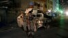 Afghan policemen stand guard near the site of an attack on a shrine in Kabul, Afghanistan October 11, 2016. 