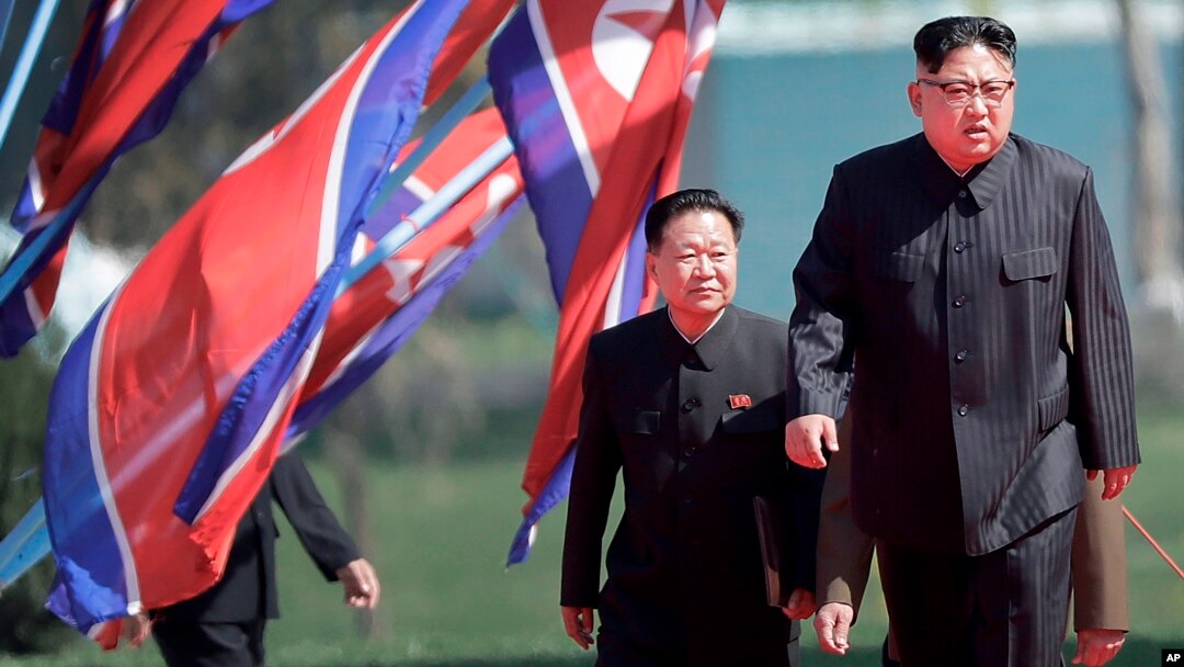 North Korean leader Kim Jong Un, right, and Choe Ryong Hae, vice-chairman of the central committee of the Workers' Party, arrive for the official opening of the Ryomyong residential area, in Pyongyang, North Korea, April 13, 2107. 
