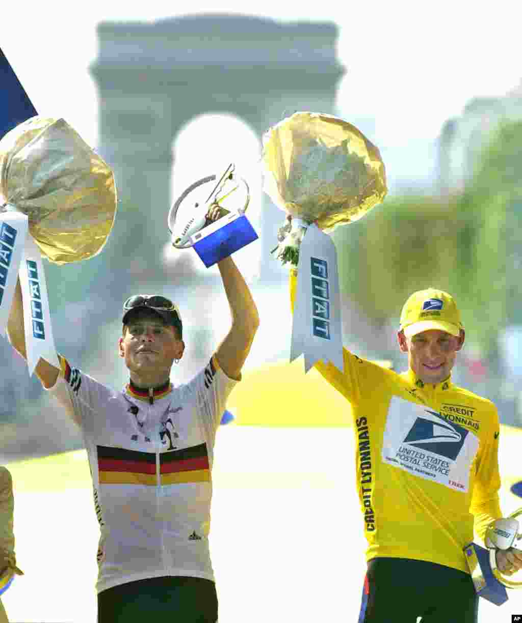 July 29, 2001: Lance Armstrong (right) on the podium next to second-placed Jan Ullrich of Germany, after winning the Tour de France for the third time.