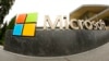 FILE - The Microsoft logo is pictured outside the company visitor center in Redmond, Wash., July 3, 2014. Microsoft said Jan. 18, 2023, that it would be cutting 10,000 workers in response to “macroeconomic conditions and changing customer priorities.”
