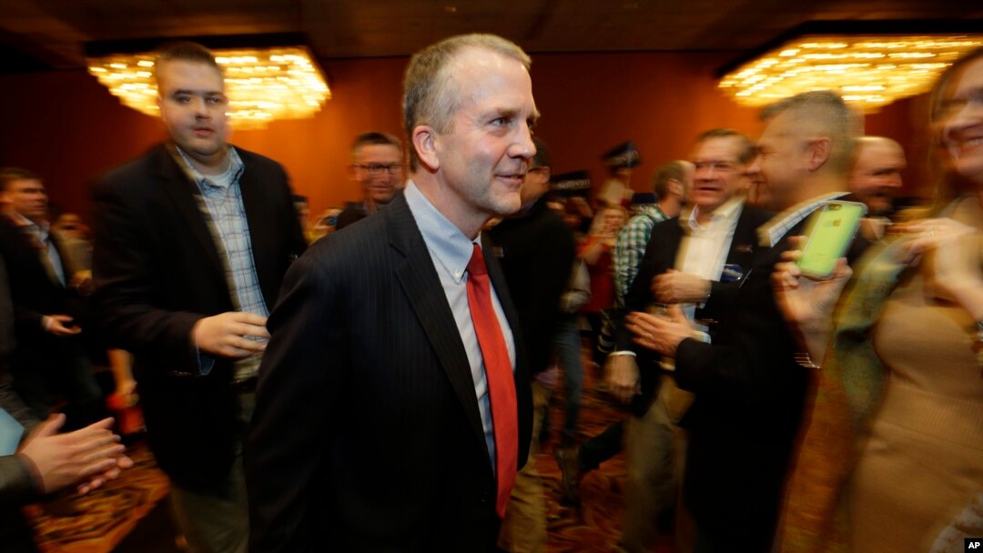 FILE - Dan Sullivan is pictured on the night he was elected to the U.S. Senate, Nov. 4, 2014, in Anchorage, Alaska. Sullivan says Saudi Arabia "needs to take sustainable, concrete actions to significantly cut oil production."
