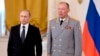 FILE - In this photo taken on March 17, 2016, Russian President Vladimir Putin, left, poses with Col. Gen. Alexander Dvornikov during an awarding ceremony in Moscow's Kremlin. (Alexei Nikolsky/Sputnik, Kremlin Pool Photo via AP)