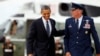 FILE - Michael Minihan, right, now a U.S. Air Force general, walks with President Barack Obama to board Air Force One, at Andrews Air Force Base, Maryland, June 4, 2012.