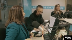 FILE - Voice of America Afghan service journalists Noshaba Ashna, Hafiz Assefi and Roya Zamani on the air at VOA headquarters in Washington.