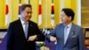 FILE - South Korean Foreign Minister Park Jin, left, and Japanese counterpart Yoshimasa Hayashi bump elbows before their talk in Tokyo, July 18, 2022. 
