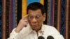 FILE - Philippine President Rodrigo Duterte gestures during his 4th State of the Nation Address at the 18th Congress at the House of Representatives in Quezon city, metropolitan Manila, Philippines, July 22, 2019. 