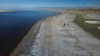 Record-low water levels are seen at the Great Salt Lake, Sept. 6, 2022, near Salt Lake City. A heat wave is breaking records in Utah, where temperatures hit 105 degrees F (40.5 C) on Tuesday. Heat waves are among the many environmental challenges facing the planet.