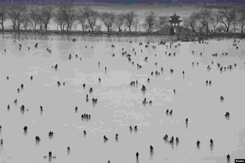 People visit a skating rink on the frozen Kunming Lake at the Old Summer Palace in Beijing, China Jan. 21, 2018.