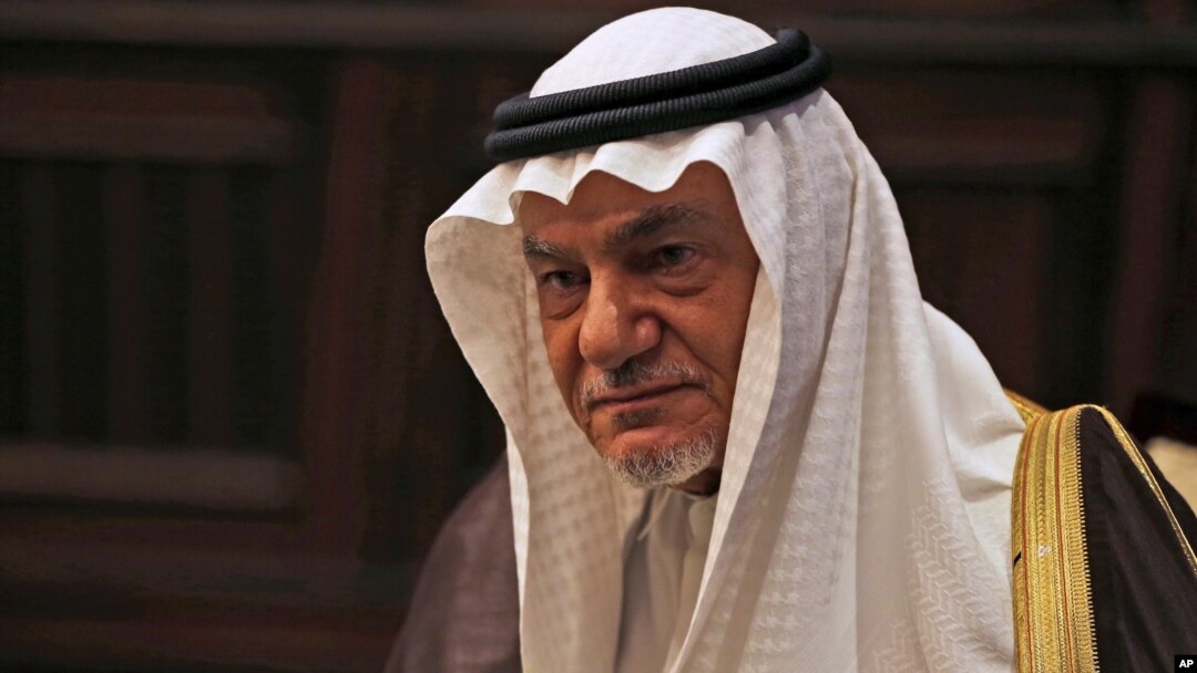 FILE - Saudi Prince Turki al-Faisal talks to the Associated Press in Abu Dhabi, United Arab Emirates, Nov. 24, 2018.