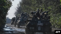 Wanajeshi wa Ukraine kwenye magari ya kijeshi, Novoselivka, Sept. 17, 2022