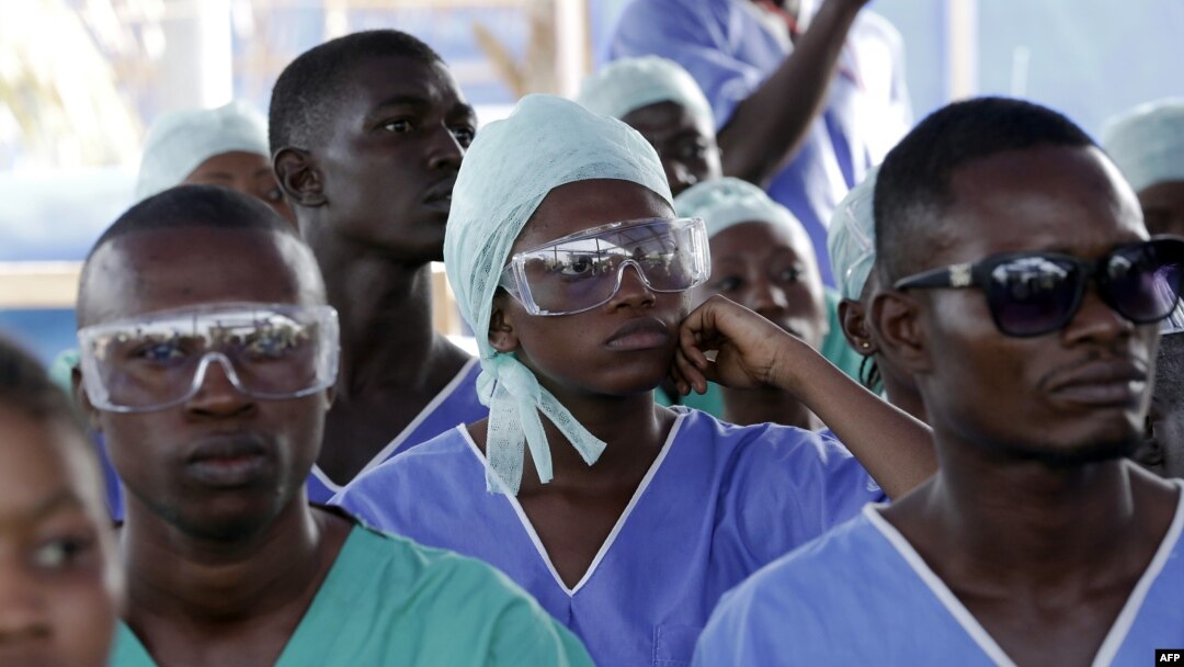 FILE - Medics attend specialized training in an Ebola treatment unit in Freetown, Sierra Leone, Dec. 19, 2014.