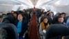 FILE - Passengers are seen during a flight of VietJet Air from Hanoi to Ho Chi Minh city, Vietnam, Jan. 12, 2018. 
