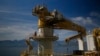 FILE - A worker walks on Turkey's new drillship 'Conquerer' off the coast of Antalya, southern Turkey, Oct. 30, 2018. Turkey says it has begun a search for oil and gas in east Mediterranean waters in a move that could stoke regional tensions.