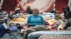 FILE - Residents of the Ukrainian city of Mariupol stay at a temporary accommodation center for evacuees in a local school in Taganrog in the Rostov region, Russia, March 23, 2022. 