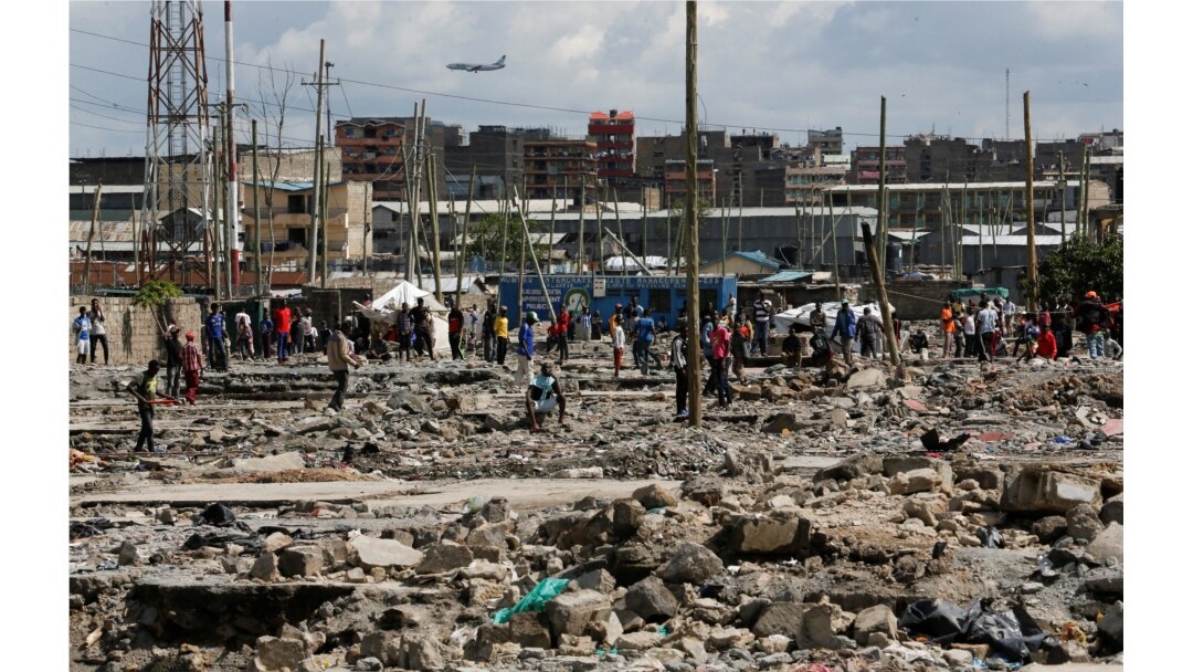 Residents gather during a clash over the demolition of homes at the Mukuru Kwa Njenga informal settlements in Nairobi, Dec. 27, 2021.