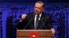 Turkey's President Recep Tayyip Erdogan announces plan of action for the first 100 days of his new presidency, in Ankara, Turkey, Friday, Aug. 3, 2018. 