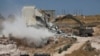 Israeli forces destroy a building in a Palestinian village of Sur Baher, east Jerusalem, July 22, 2019.