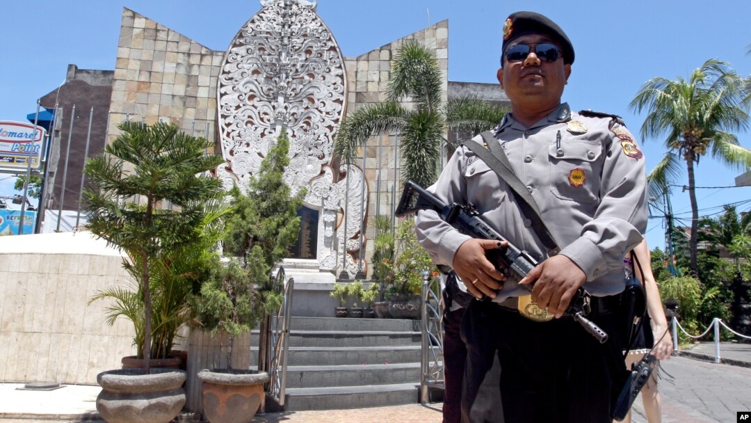 A police officers stands at the memorial of the 2002 Bali bombing site in Bali, Indonesia, Jan. 15, 2016. 